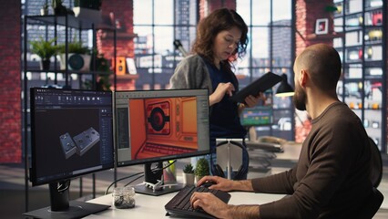 Coworkers using AI chatbot interface to generate video game spaceship environments, modern system applies deep learning and machine learning techniques. Developing sci fi gaming designs. Camera A. © DC Studio