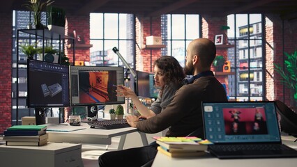 Man and woman work with AI generated app to develop a futuristic spaceship station. Neural network powered software uses automation and machine learning to generate game environments. Camera A.