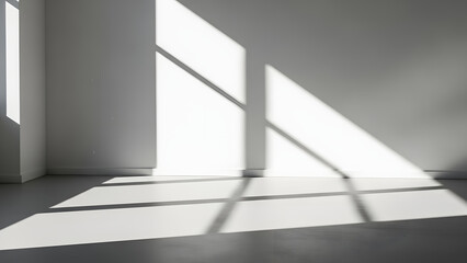 Obraz premium Geometric Shadows: A minimalist architectural interior is bathed in natural light, showcasing the interplay of sharp shadows cast across the stark surfaces, creating a study in contrasts.