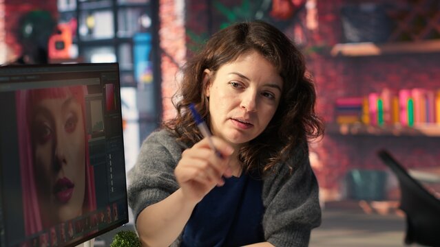 Photographers team collaborating on editing high quality content using a software. Editing interface provides advanced image enhancement and color correction tools, photo retouching. Camera B.