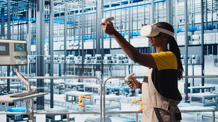 Engineer wearing VR headset in smart factory looking at collected data to do optimizations....