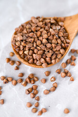 Close up of Buckwheat Grains in Bamboo Spoon