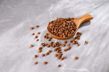 Close up of Buckwheat Grains in Bamboo Spoon