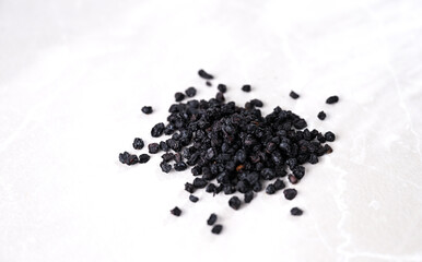 Dried Elderberry Berries on White Background