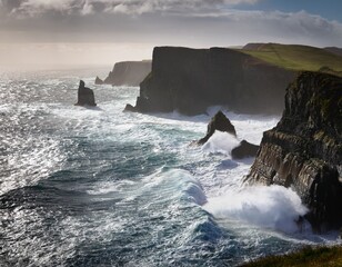 dramatic coastline with crashing waves and misty cliffs