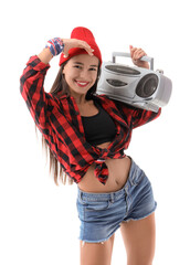 Female hip-hop dancer in hat with boombox on white background