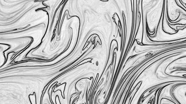 This stock video features an extreme close-up shot of a liquid mixture of clack an paints. It can be a great background for your computer screens. And if you need a compositing element for your motion