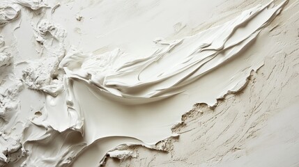 A white paint brush with white paint on it