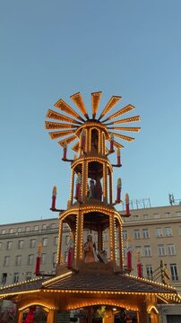 Big decorative spinning pyramid with religion scenes on Bethlehem Christmas fair 2026 in Poznan, Poland close up