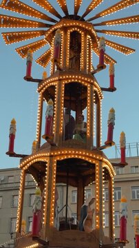 Big decorative spinning pyramid with religion scenes on Bethlehem Christmas fair 2026 in Poznan, Poland close up