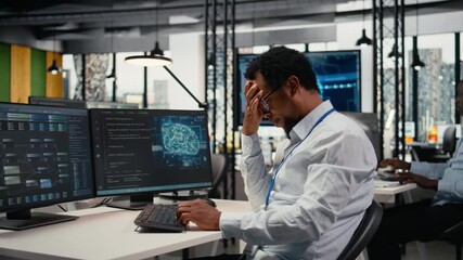 Startup office coworkers having fun chat, using artificial intelligence driving market innovation. Tech agency employees joking in workplace, working with machine learning, camera A