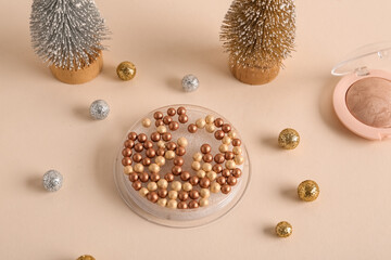 Beautiful composition with decorative Christmas trees, highlighter pearls and shiny golden beads on...