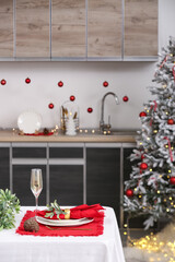 Christmas table setting in kitchen, closeup