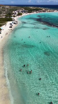 4K 60FPS Video: Baby Beach Aruba. Aerial Descent and Industrial Refinery Contrast.