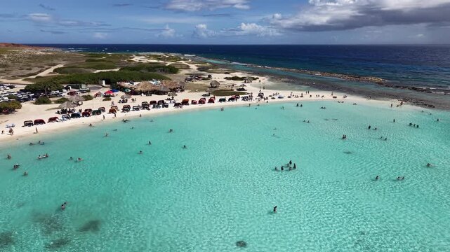 4K 60FPS Video: Baby Beach Aruba. Aerial Descent and Industrial Refinery Contrast.