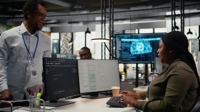 Technicians doing brainstorming in office, using specialized hardware to accelerate complex AI calculations. Teamworking colleagues managing systems for machine learning training datasets, camera A