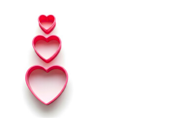 Stacked Pink Heart Cookie Cutters on White