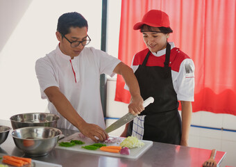 Chefs preparing ingredients while teaching culinary skills