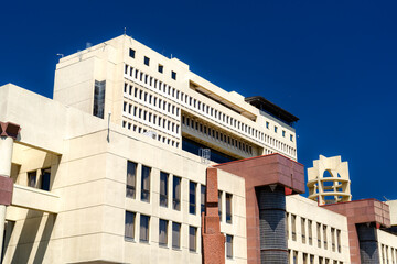 View of the National Congress of Chile building in Valparaiso. The massive modern government structure features large columns and a wide entrance under a deep blue sky