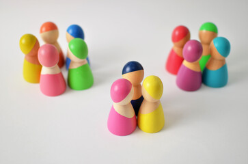 Colorful wooden figures forming groups and communities
