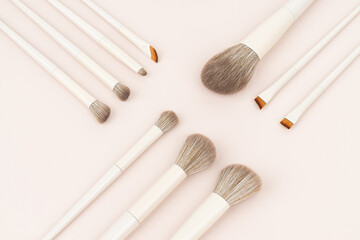 Makeup Brush Set Flat Lay on Soft Pink Background
