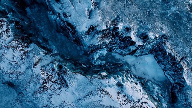 Aerial view of icy blue glacier