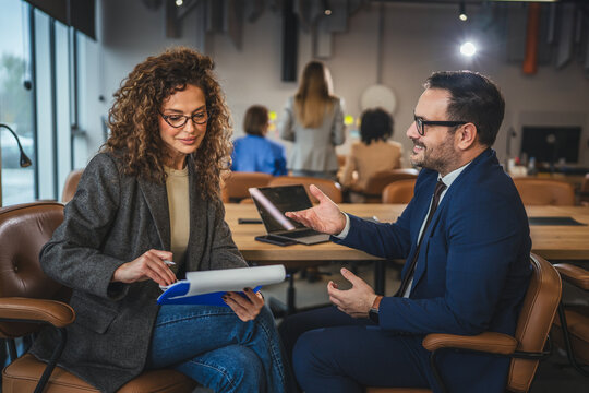 Business professionals discussing strategy during an office meeting