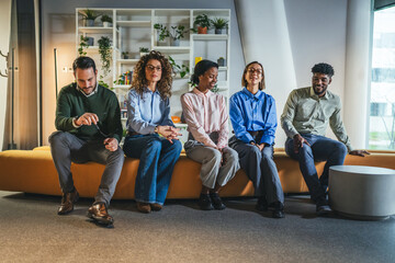 Diverse business team waiting for meeting in modern office lobby