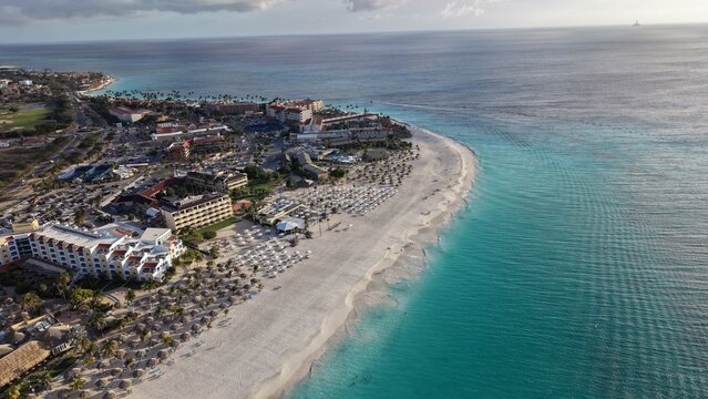 Aerial View of Eagle Beach, Aruba: White Sand, Turquoise Water, and Fofoti Trees.
