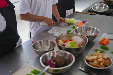Chef preparing vegetables for cooking class in kitchen