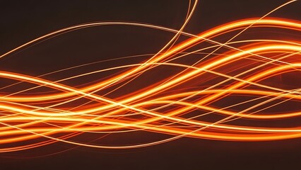 Abstract orange light streaks on dark background, energy flow concept.