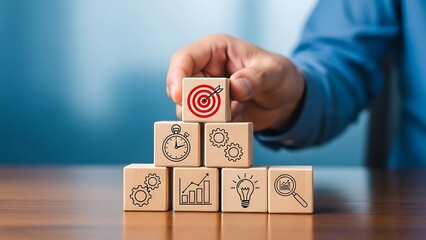 Achieving Goals - Hand Placing Target Block on Wooden Cubes.