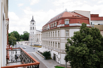 Obraz premium Vilnius/Lithuania - 07 19 2025: Vilnius Cathedral and Bell Tower viewed from a hotel window overlooking the historic city center in Vilnius, Lithuania