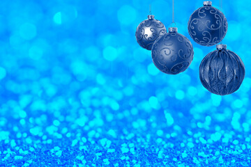 Christmas balls against shiny background. Happy winter holidays