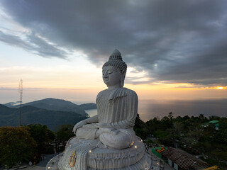 Vesak day background concept of Big buddha over high mountain in Phuket thailand Aerial view drone shot
