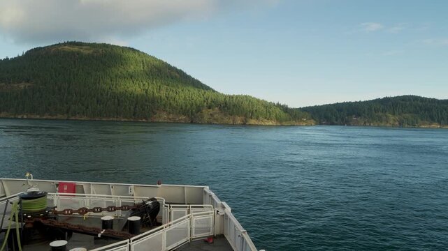 BC Ferry sailing past islands in coastal waters, British Columbia, Canada