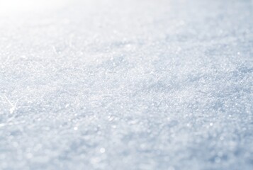 Obraz premium Close up of pristine white snow surface with sparkling ice crystals. Winter season nature background with frosty texture for holiday design.