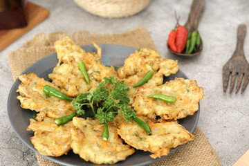 Indonesian Vegetable Fritters Bakwan with Green Chili on Plate Traditional Snack