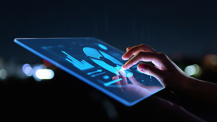 Dynamic close up of glowing blue digital analytics interface being expertly navigated by a fingertip at night