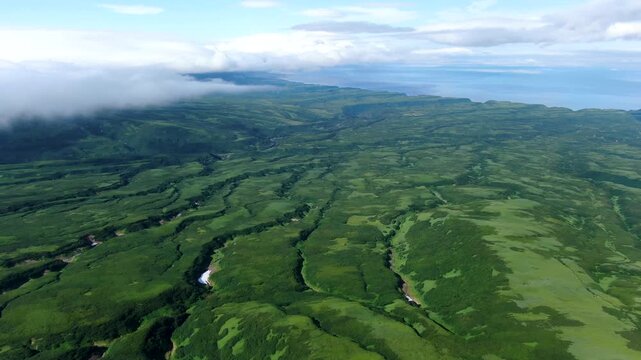 Flight over the caldera of the extinct volcano Lion's Mouth, Iturup Island, Kuril Islands