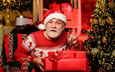 Online shopping. bearded man go shopping. xmas gifts. winter holiday shopping. party celebration. presents from santa. happy new year. Secret santa. gifts at Christmas tree. Merry christmas