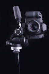 photography equipment DSLR camera on black background