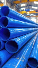 Stack of blue plastic pipes indoor