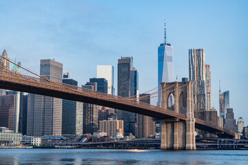 Urban architecture of New York city view. Brooklyn bridge of New York city. Brooklyn landmark. Manhattan cityscape with skyscraper architecture. Brooklyn bridge to Manhattan