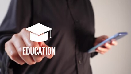 A businesswoman holding a smartphone while pointing at an animated graduation cap with the word "Education"