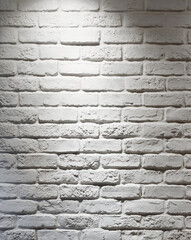 white brick wall with spotlight