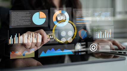 A businesswoman engages with advanced digital data visualization tools, analyzing key performance indicators through artificial intelligence for enhanced decision-making. Gantry
