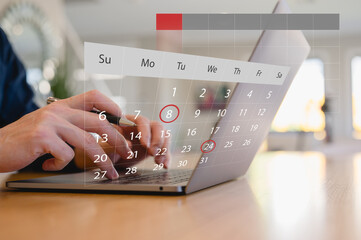 Hands using laptop with digital calendar overlay showing marked dates, representing online scheduling, appointment booking, time management, reminder planning and productivity workflow.