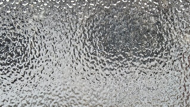 Blurred frosted glass texture. Window backdrop with shadows and reflections. Glass effect background. Abstract gradient bright light reflection and shiny rough texture surface