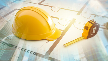 Construction planning involves reviewing architectural blueprints with a hard hat and measuring tape, preparing project layouts and ensuring accurate building specifications.